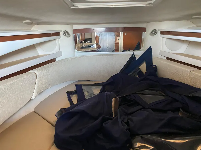 Slide: The Image of Interior of 2008 Sea Ray 270 Amberjack boat with seating and storage. - 20