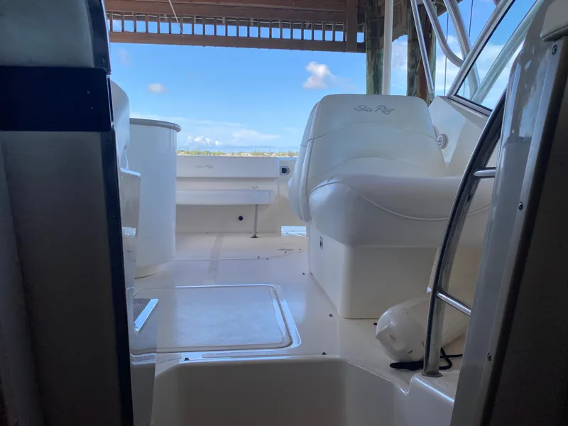 Slide: The Image of 2008 Sea Ray 270 Amberjack boat interior with white seating and open deck view. - 23