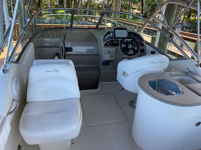 Slide: The Image of 2008 Sea Ray 270 Amberjack boat interior with helm, seating, and dashboard. - 26