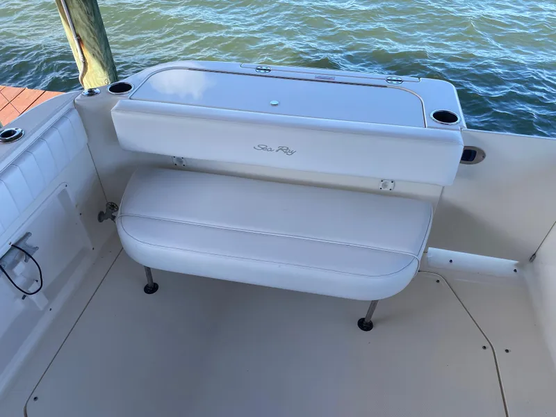 Slide: The Image of 2008 Sea Ray 270 Amberjack boat interior with white seating and cup holders. - 27