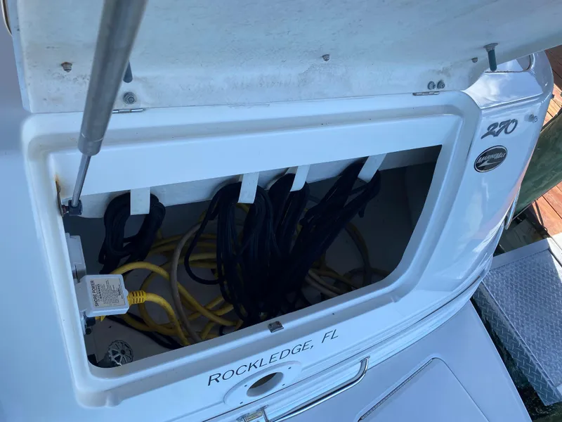 Slide: The Image of 2008 Sea Ray 270 Amberjack storage compartment with cables, located in Rockledge, FL. - 29
