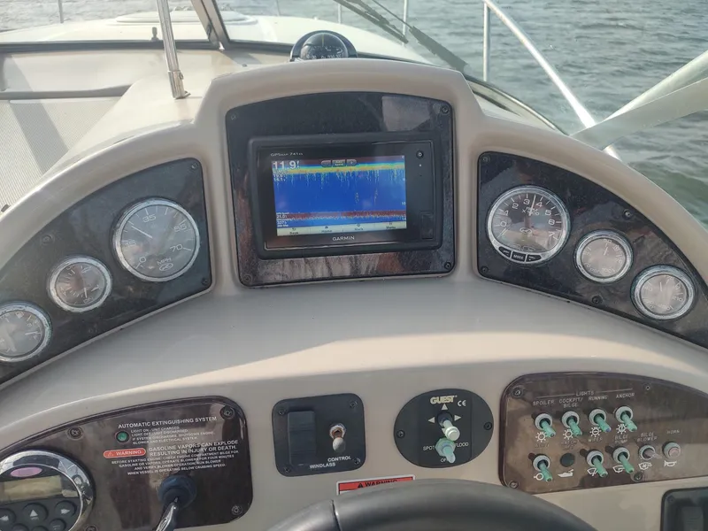 Slide: The Image of Dashboard of a 2008 Sea Ray 270 Amberjack boat with Garmin GPS display. - 32