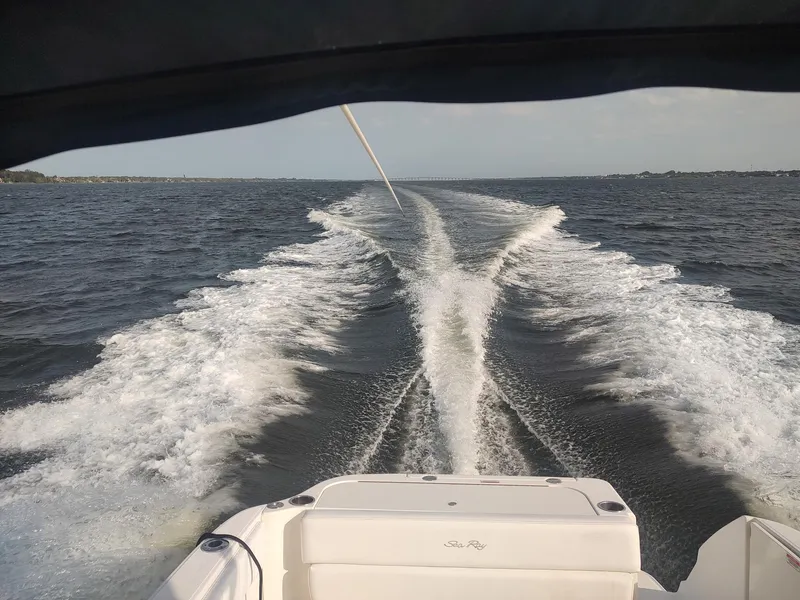 Slide: The Image of 2008 Sea Ray 270 Amberjack cruising, leaving a wake on open water. - 33