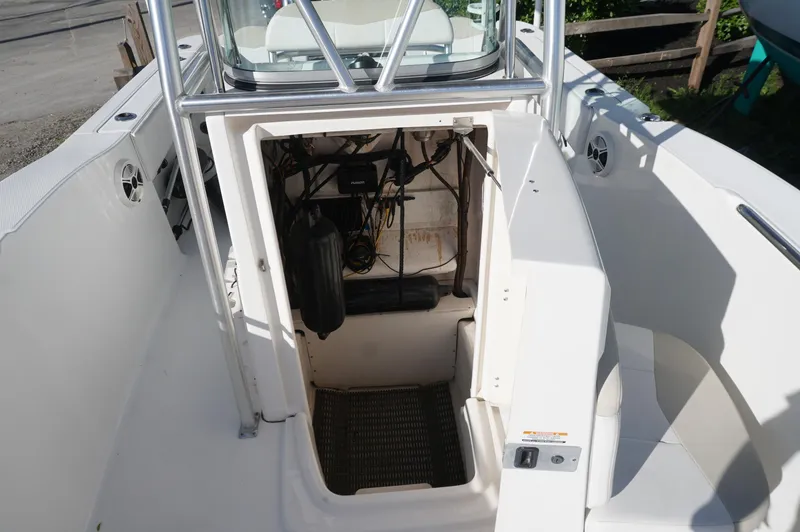 Slide: The Image of 2012 Robalo R200 Center Console boat interior with open storage compartment. - 15