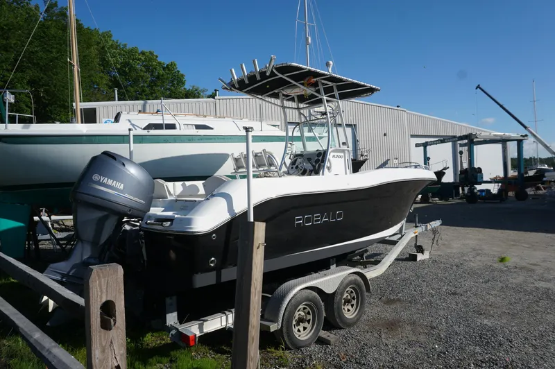 Slide: The Image of 2012 Robalo R200 Center Console boat on trailer with Yamaha outboard motor. - 2