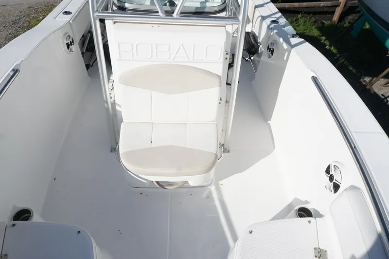 Slide: The Image of 2012 Robalo R200 Center Console boat interior with seating and storage. - 21