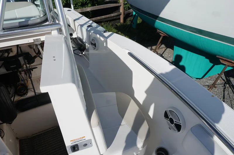 Slide: The Image of 2012 Robalo R200 Center Console boat interior with seating and speaker. - 23
