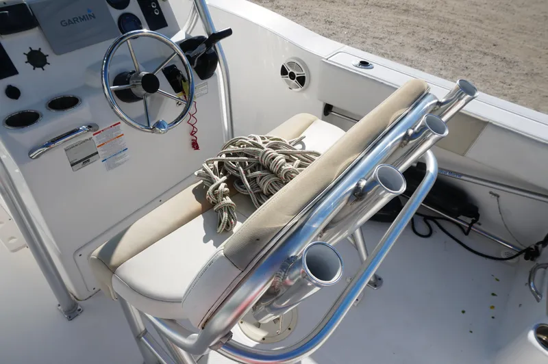 Slide: The Image of 2012 Robalo R200 Center Console boat interior with steering wheel and rope. - 31