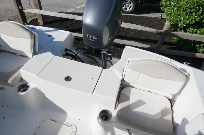 Slide: The Image of 2012 Robalo R200 Center Console boat with Yamaha 115 engine, featuring white seating and deck. - 35