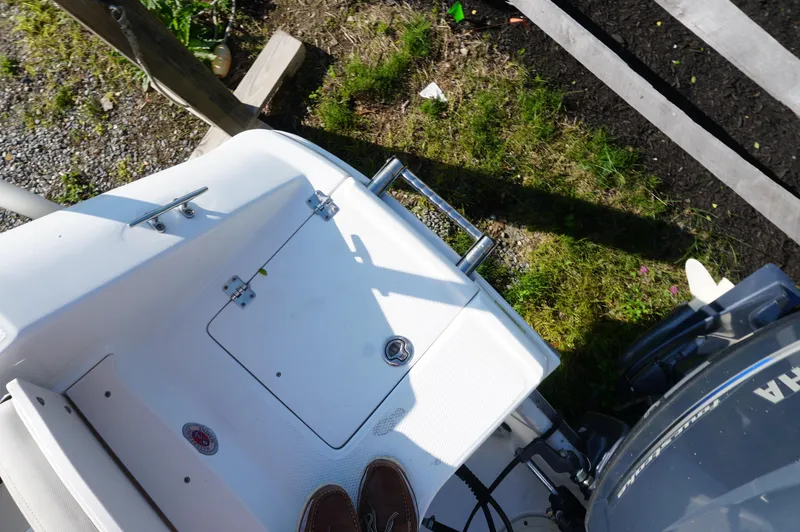 Slide: The Image of 2012 Robalo R200 Center Console boat deck with ladder and engine. - 36