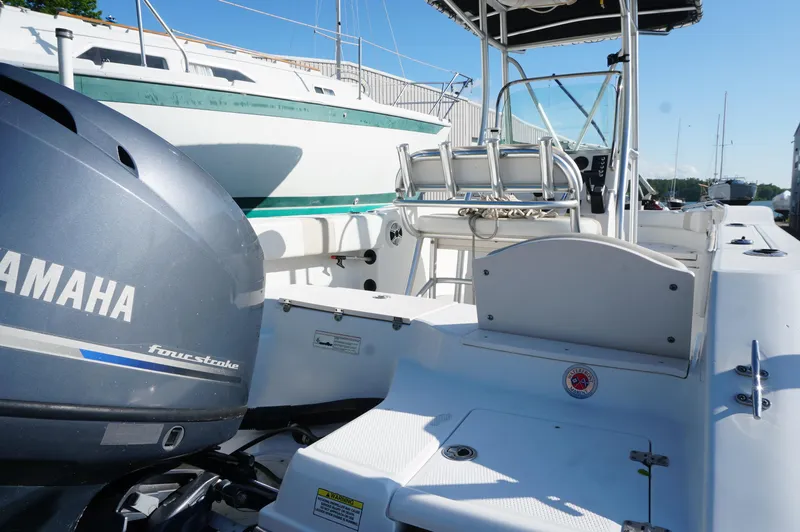 Slide: The Image of 2012 Robalo R200 Center Console boat with Yamaha four-stroke engine, docked outdoors. - 38