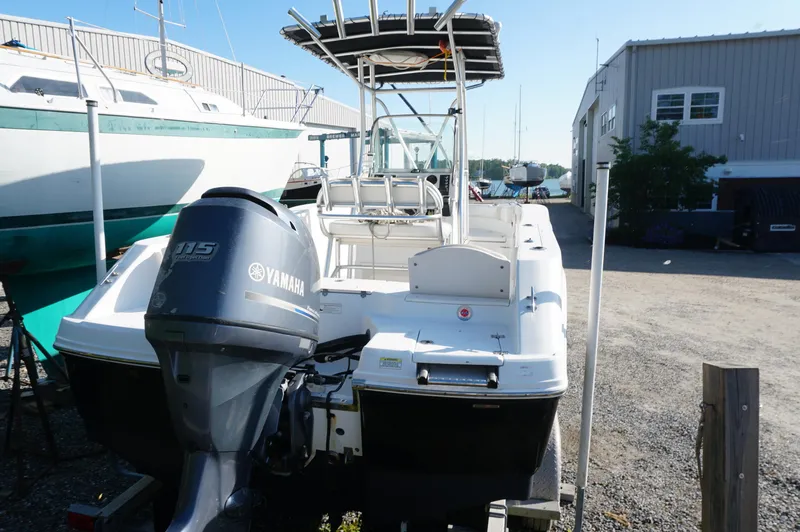 Slide: The Image of 2012 Robalo R200 Center Console boat with Yamaha 115 engine in a marina. - 9