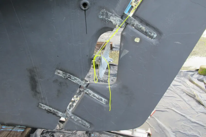 Slide: The Image of Rudder of a 1979 Cape George 36 sailboat, showing structural details and maintenance work. - 26