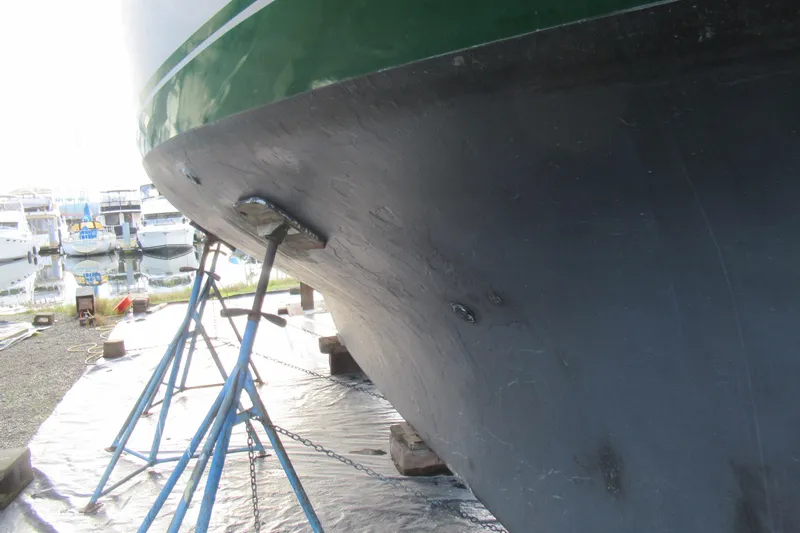 Slide: The Image of Cape George 36 sailboat hull from 1979 on stands at marina. - 28