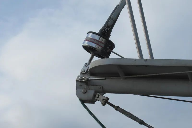 Slide: The Image of Close-up of rigging on a 1979 Cape George 36 sailboat against a cloudy sky. - 31