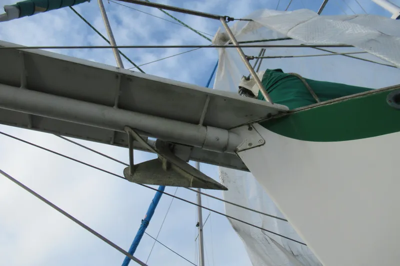 Slide: The Image of Sailboat rigging and anchor on a 1979 Cape George 36 under a blue sky. - 33