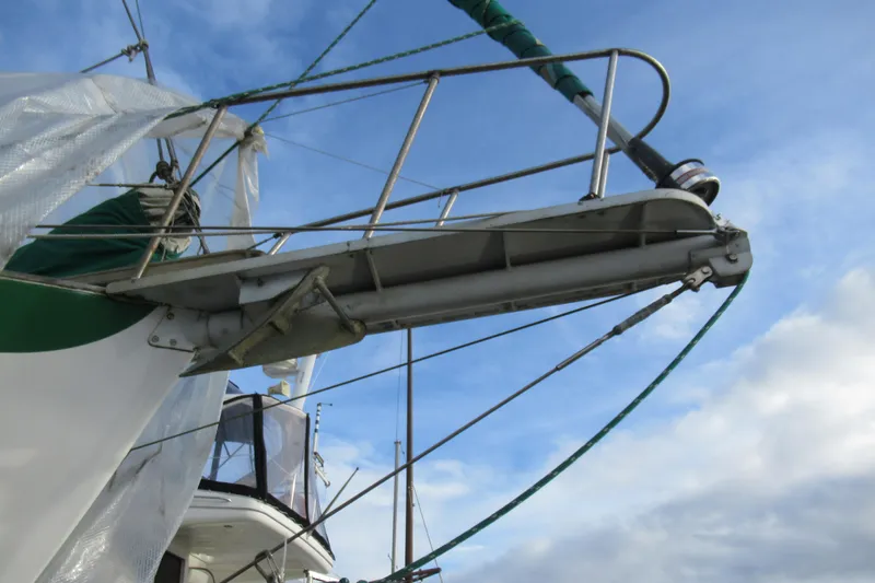 Slide: The Image of Bowsprit of 1979 Cape George 36 sailboat against a clear blue sky. - 35