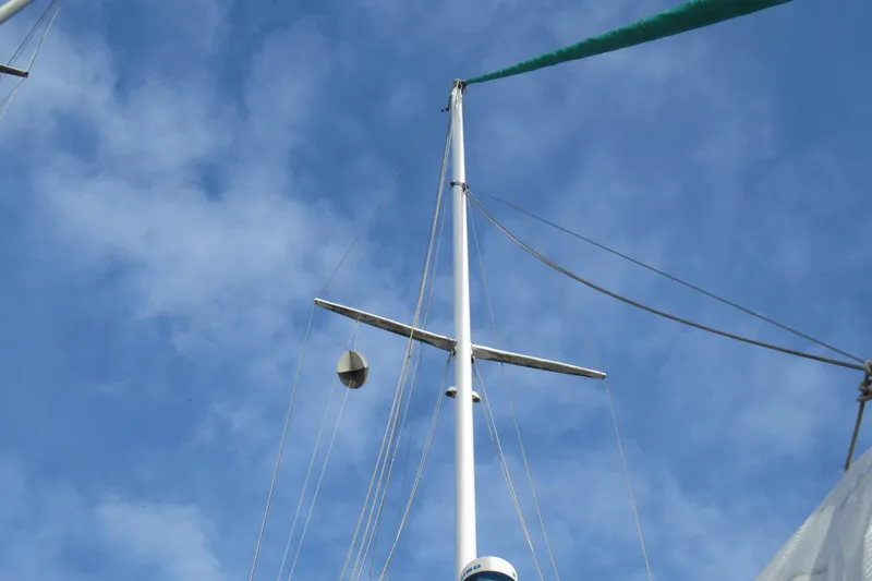 Slide: The Image of Mast of 1979 Cape George 36 sailboat against a clear blue sky. - 39