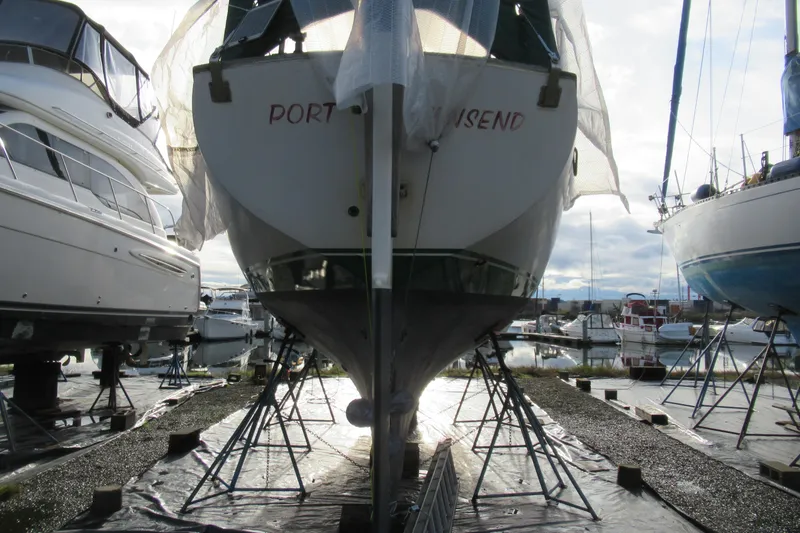 Slide: The Image of Cape George 36 sailboat from 1979 in a boatyard, Port Townsend. - 49
