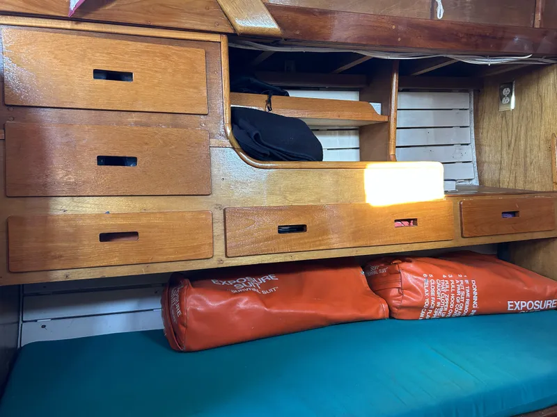 Slide: The Image of Wooden interior of 1979 Cape George 36 sailboat with drawers and storage compartments. - 8