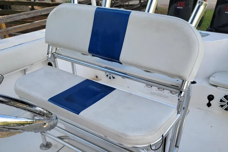 Slide: The Image of 2012 Carolina Skiff 24 boat seat with blue and white upholstery, chrome accents. - 5