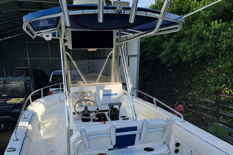 Slide: The Image of 2012 Carolina Skiff 24 boat with navigation equipment, parked in a covered area. - 6