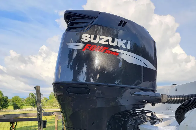Slide: The Image of Suzuki Four Stroke outboard motor on a 2012 Carolina Skiff 24 boat. - 9