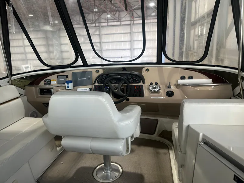 Slide: The Image of Interior cockpit of a 2005 Carver 44 CMY yacht with steering wheel and controls. - 5