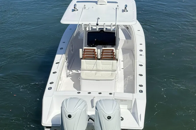 Slide: The Image of 2023 Jupiter 30 boat with dual engines on calm water. - 4