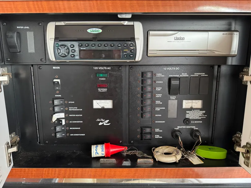 Slide: The Image of Electrical control panel of a 2003 Sea Ray 290 Amberjack boat with Clarion stereo system. - 15