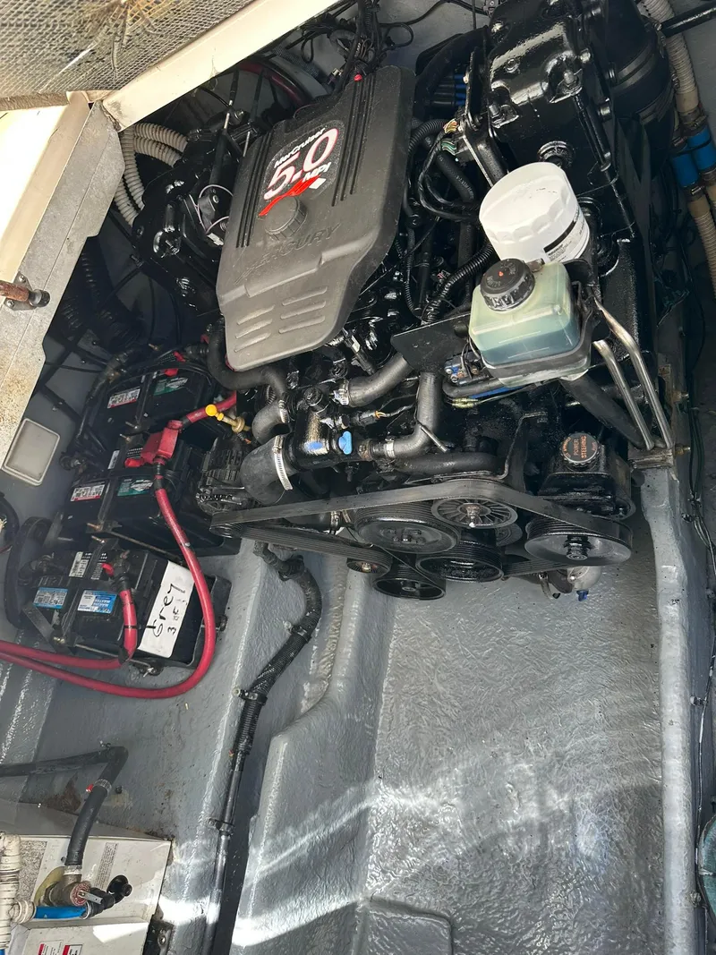 Slide: The Image of Engine compartment of a 2003 Sea Ray 290 Amberjack boat, featuring a 5.0 engine. - 17