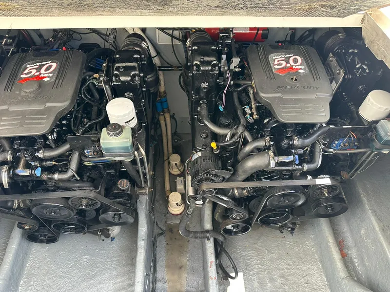 Slide: The Image of Twin Mercury 5.0 MPI engines in a 2003 Sea Ray 290 Amberjack boat. - 19