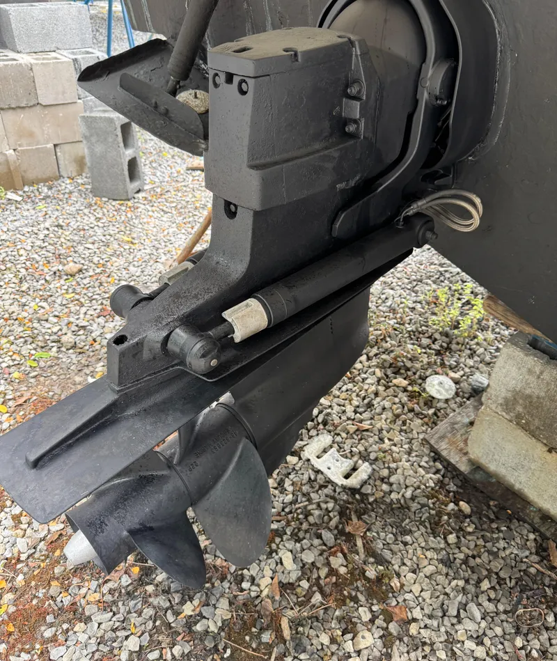 Slide: The Image of Close-up of a 2003 Sea Ray 290 Amberjack boat propeller on gravel. - 24