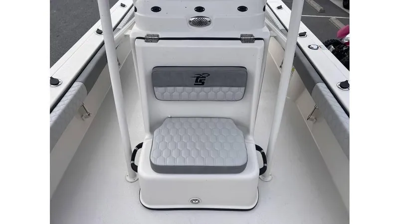 Slide: The Image of 2025 Carolina Skiff 24 Ultra Elite boat seat with hexagonal pattern upholstery. - 11