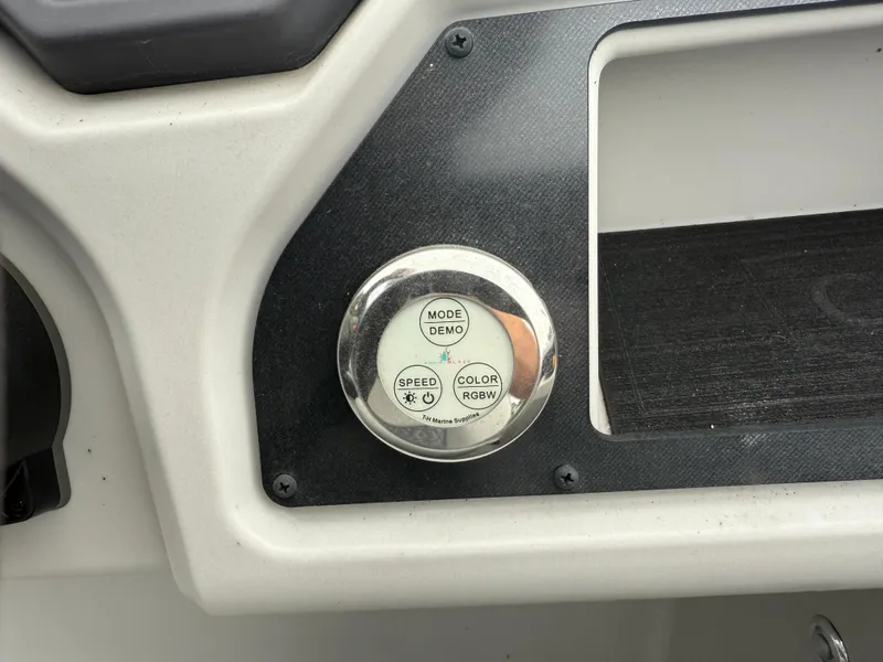 Slide: The Image of Control panel on 2023 Godfrey Sweetwater boat with mode, speed, and color settings. - 16