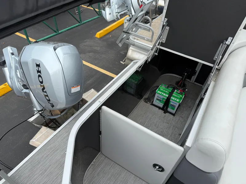 Slide: The Image of 2023 Godfrey Sweetwater boat with Honda outboard motor and Interstate battery. - 18