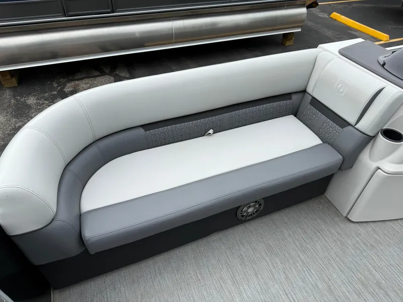 Slide: The Image of 2023 Godfrey Sweetwater boat interior with gray and white cushioned seating. - 5