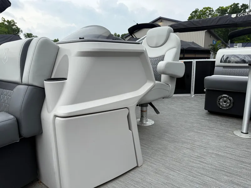 Slide: The Image of 2023 Godfrey Sweetwater boat interior with modern seating and console design. - 9
