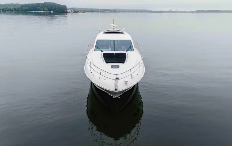 Slide: The Image of Front view of a 2013 Sea Ray 510 Sundancer yacht on calm water. - 12