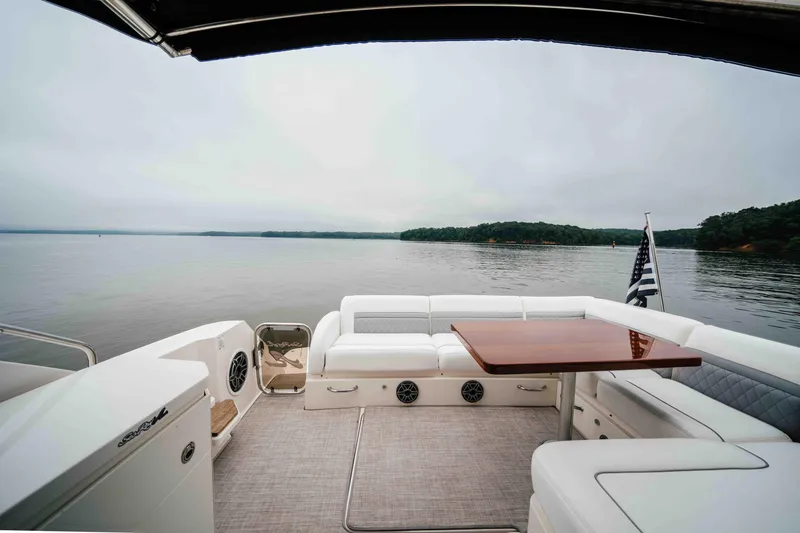 Slide: The Image of Luxurious 2013 Sea Ray 510 Sundancer yacht with elegant seating and scenic water view. - 23