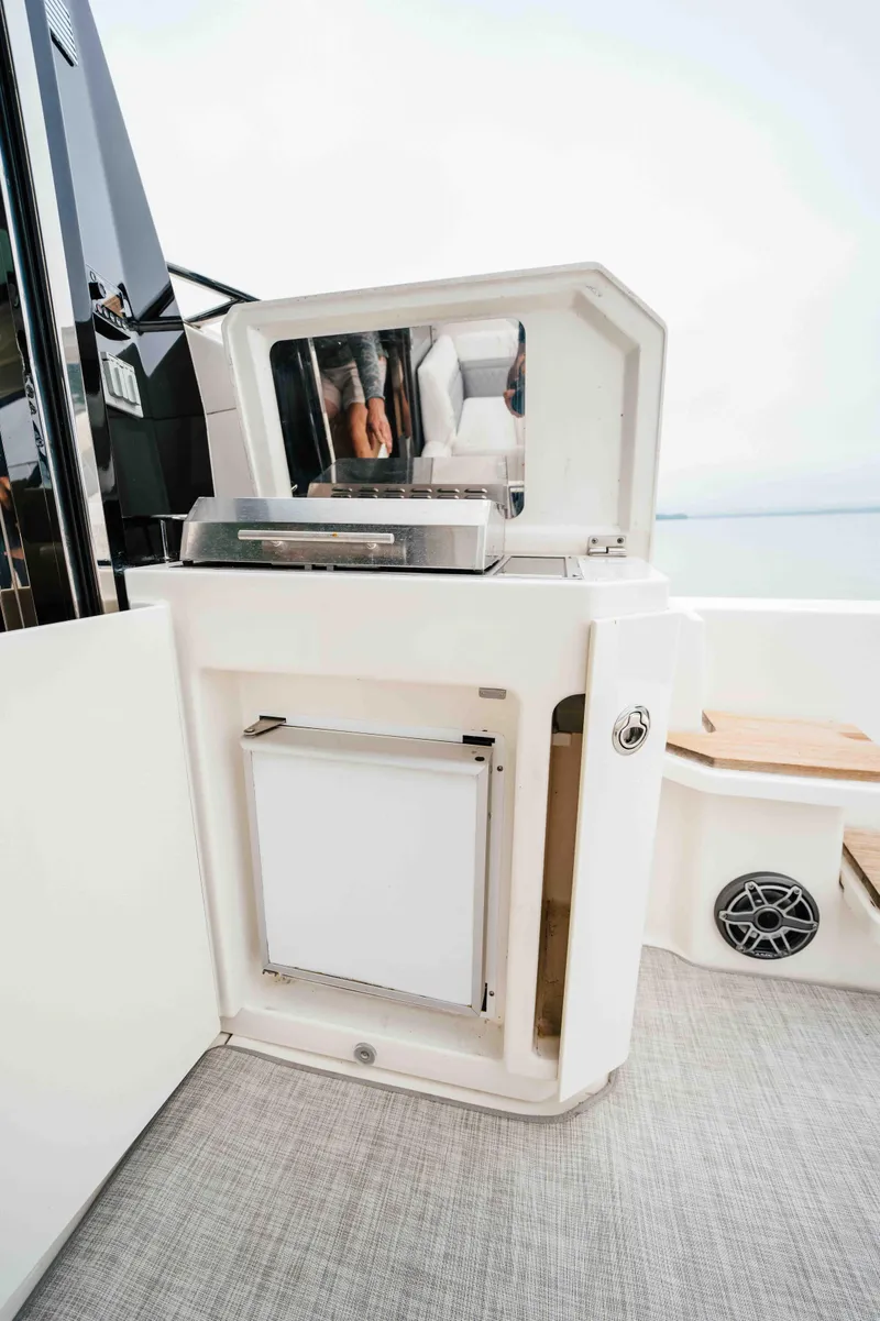 Slide: The Image of Outdoor kitchenette on 2013 Sea Ray 510 Sundancer yacht with grill and storage. - 28