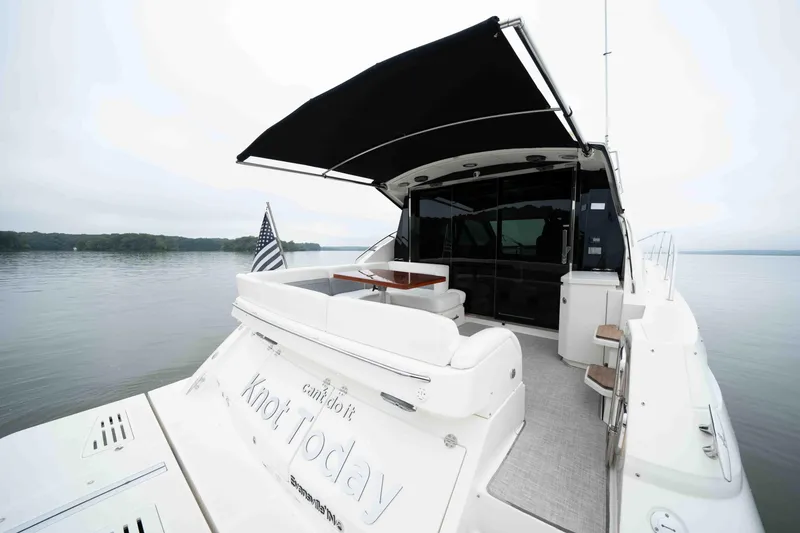 Slide: The Image of 2013 Sea Ray 510 Sundancer yacht with canopy on calm water. - 30