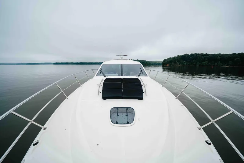 Slide: The Image of 2013 Sea Ray 510 Sundancer yacht on calm water, overcast sky. - 38
