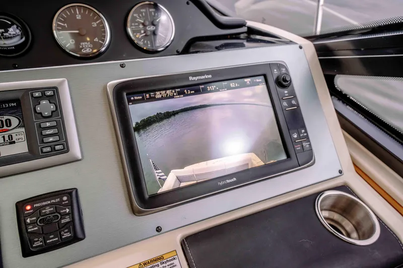 Slide: The Image of Control panel of 2013 Sea Ray 510 Sundancer with navigation display and gauges. - 47