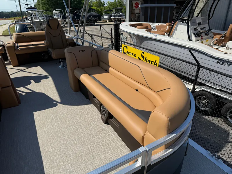 Slide: The Image of 2025 Avalon Venture 85 Versatile rear bench, tan seating, outdoor display. - 10