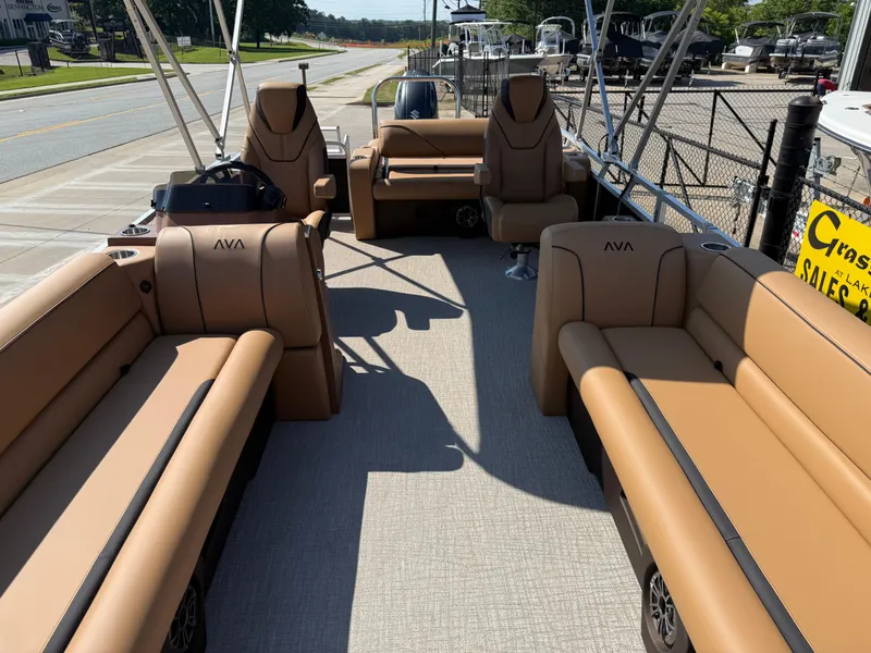 Slide: The Image of 2025 Avalon Venture 85 Versatile Rear Bench pontoon boat with tan seating and open deck layout. - 12