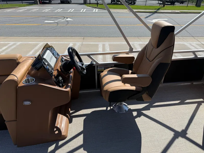 Slide: The Image of 2025 Avalon Venture 85 Versatile rear Bench boat interior with captain's chair and steering console. - 18