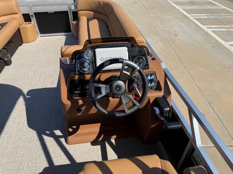 Slide: The Image of 2025 Avalon Venture 85 Versatile rear Bench boat dashboard with Garmin navigation system. - 20