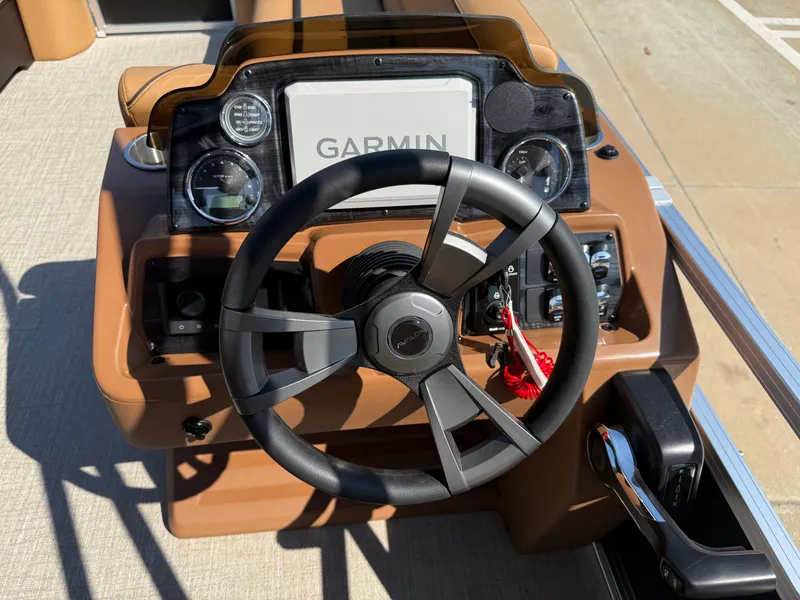 Slide: The Image of Steering console of 2025 Avalon Venture 85 Versatile with Garmin display and controls. - 21