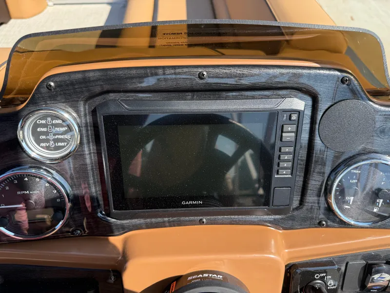 Slide: The Image of Dashboard of 2025 Avalon Venture 85 Versatile with Garmin display and gauges. - 23